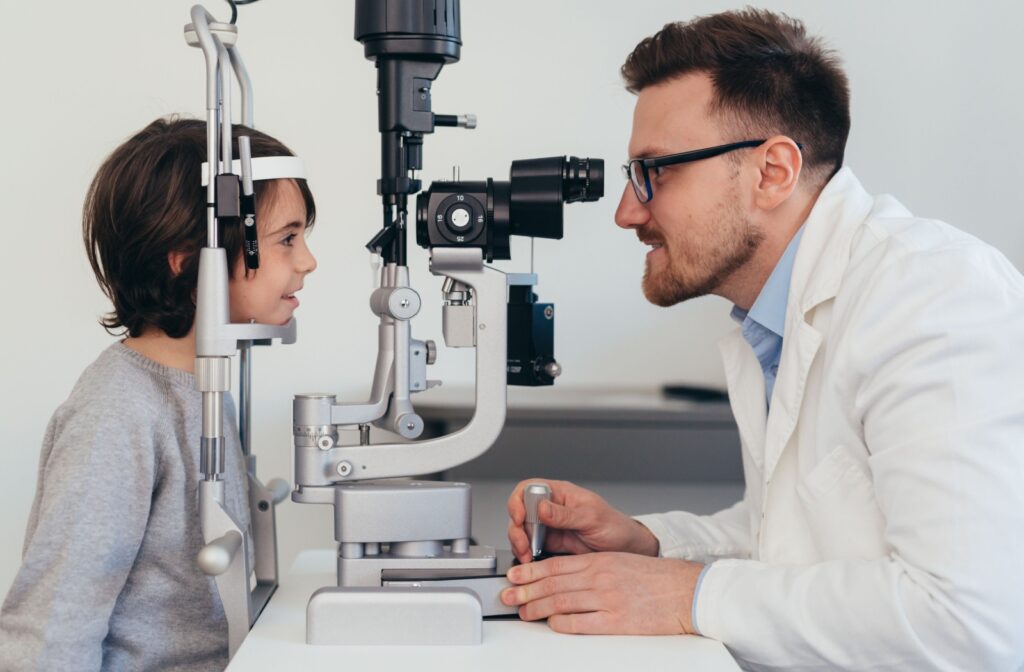 A young child have their eyes examined by an eye doctor to monitor for myopia or nearsightedness.